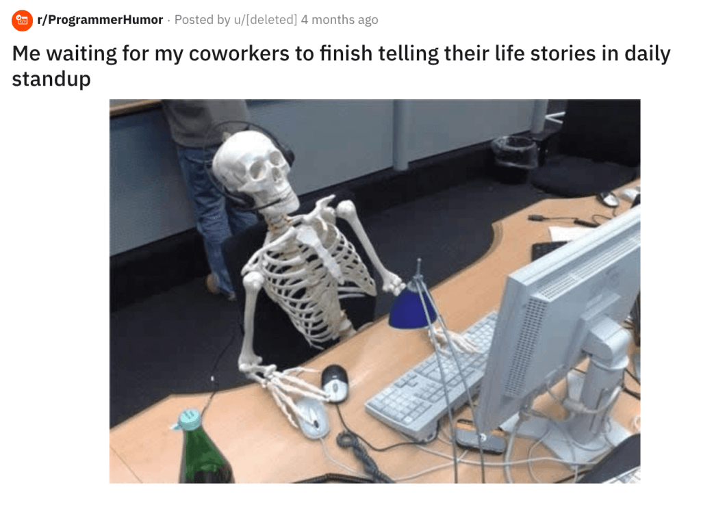 a skeleton at a desk 