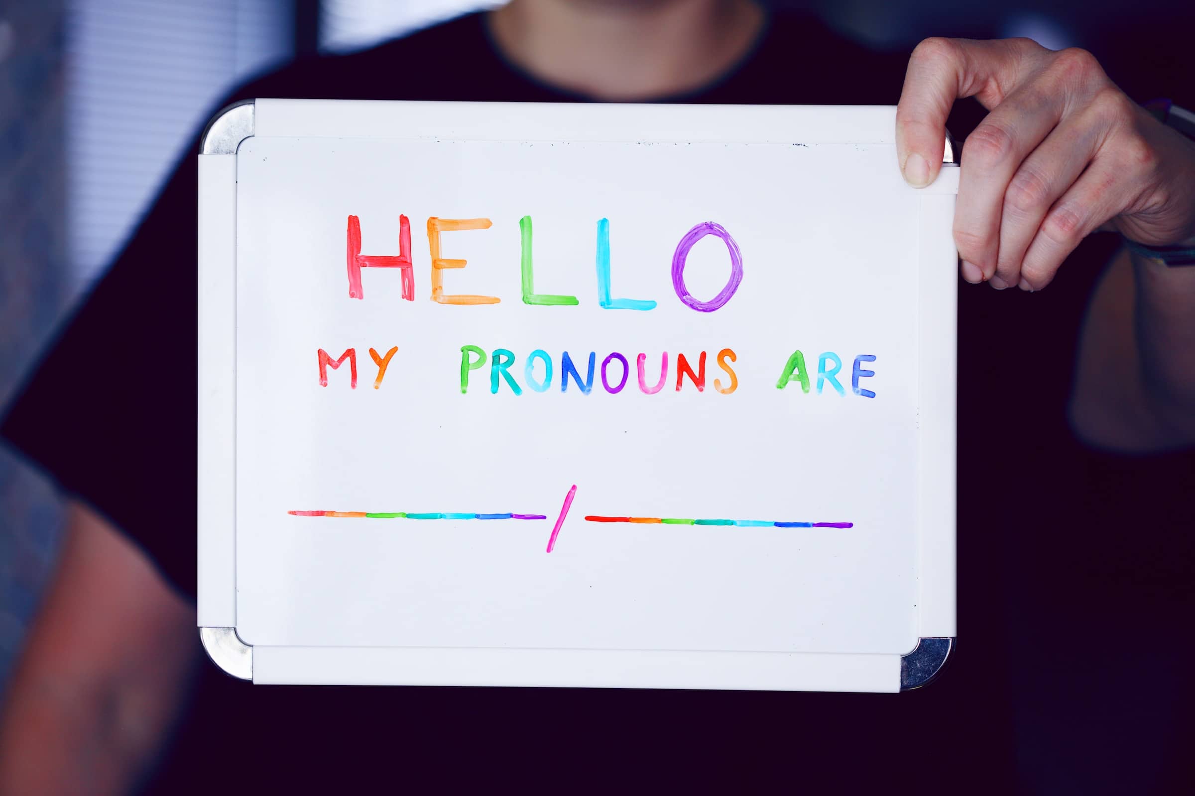 hello_my_pronouns_are_banner Photo of sign that says