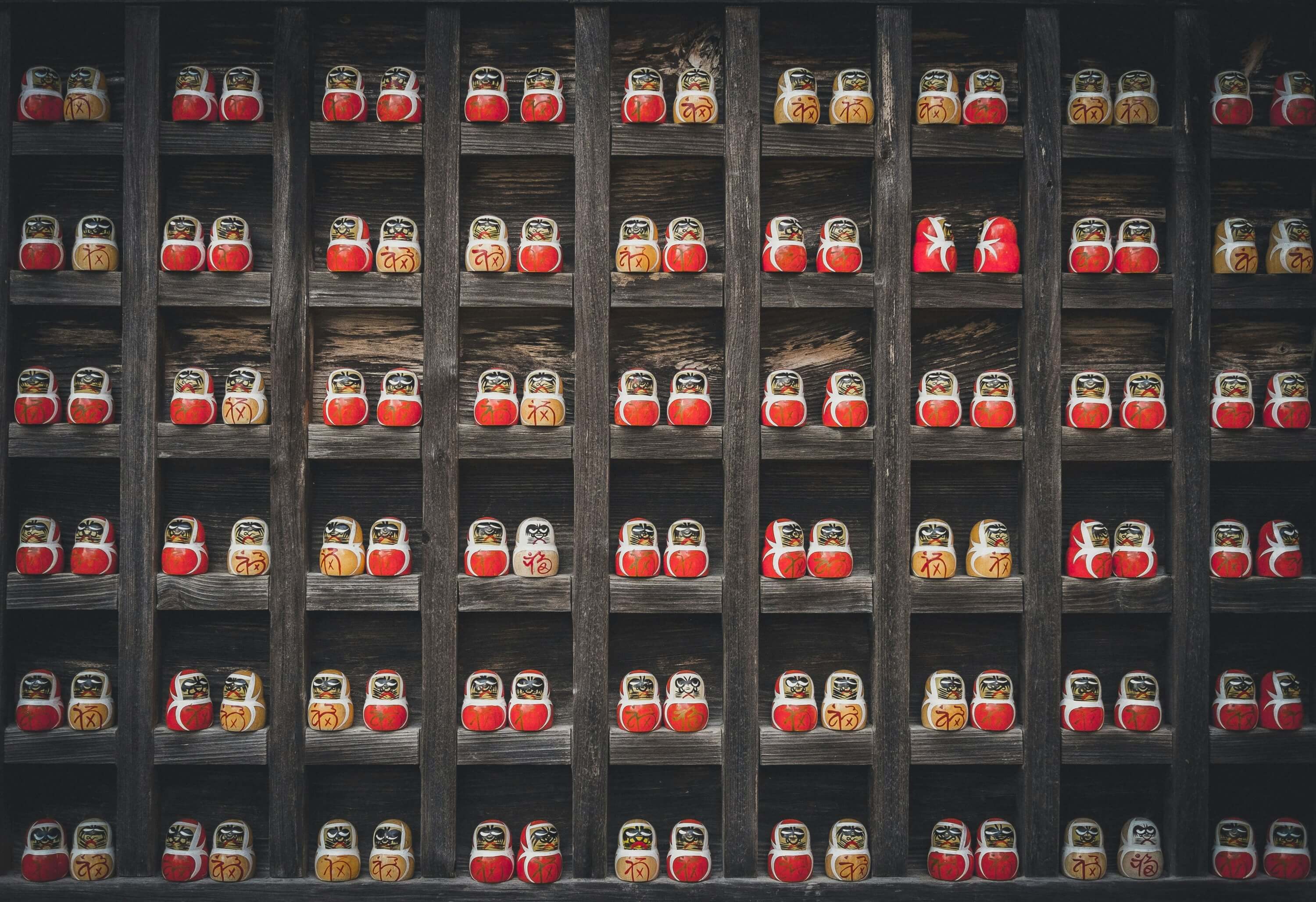Shop shelves packed with neatly organized nesting dolls