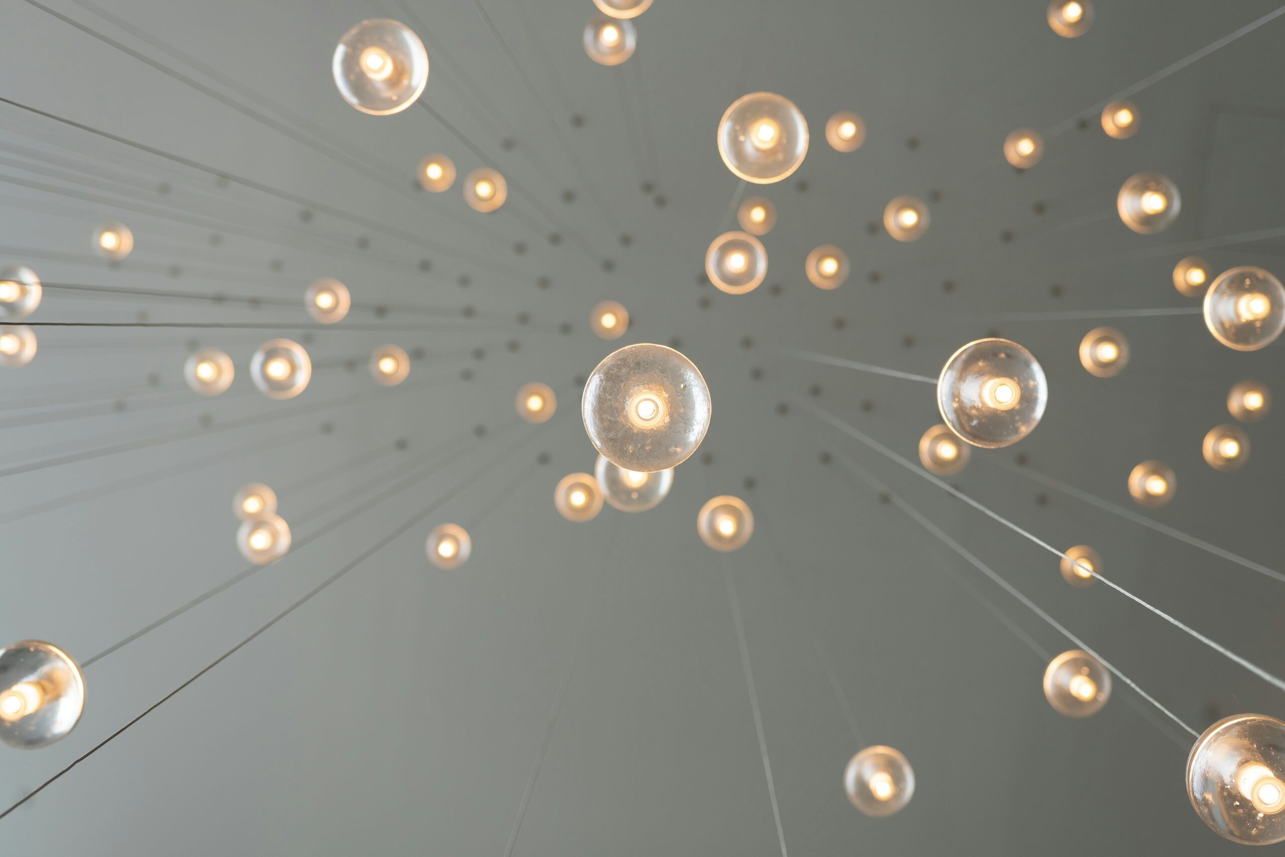 hanging lightbulbs photograph by Skye Studios from Unsplash