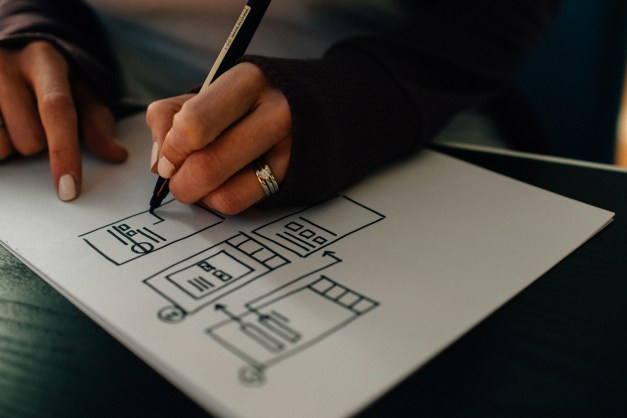 Person Writing on Paper